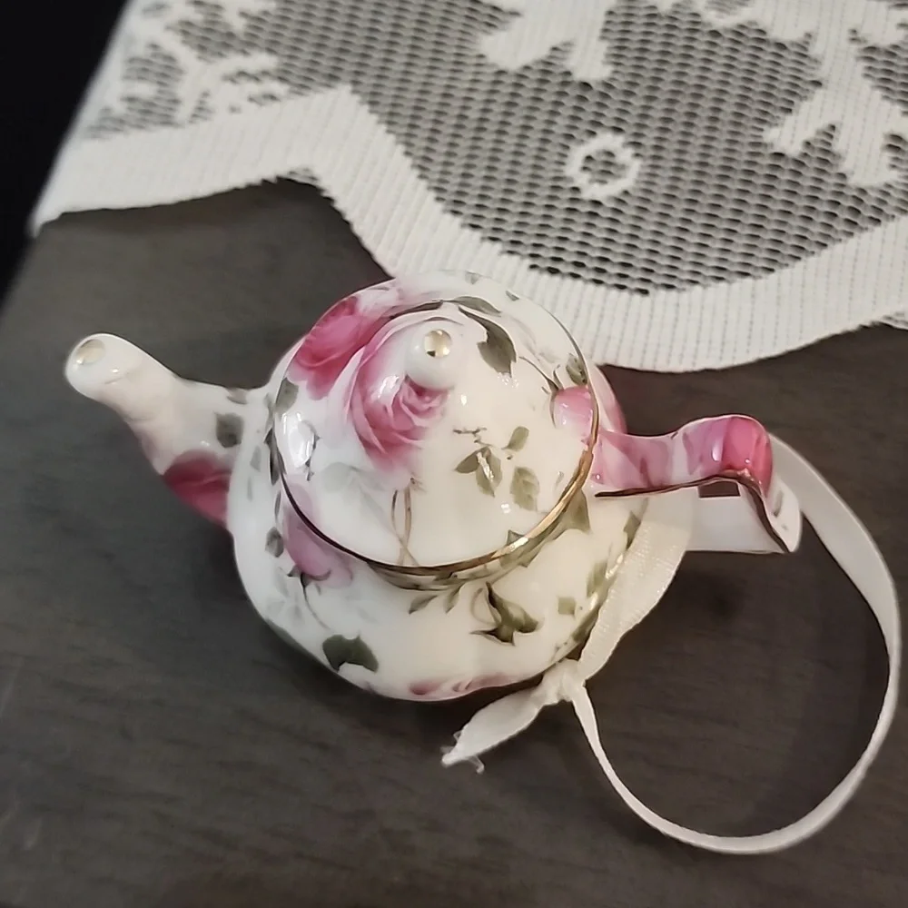Christmas ornaments, miniature tea cups and tea pots